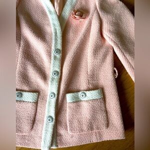 Pink and white blazer with flowers pin